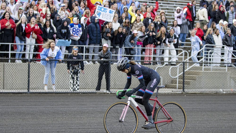 Delta Gamma cheers on one of their riders on as she passes their section during the Little 500 Qualifications on March 26, 2022, at Bill Armstrong Stadium. Delta Gamma, along with several other teams, in the early morning qualifying period faulted causing the need for a redo of their qualification runs.