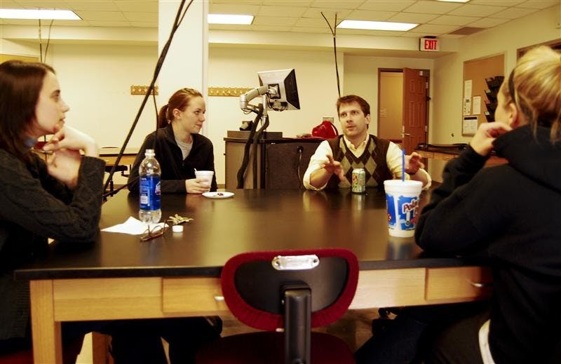 Academic Adviser Valeri Aquila, senior Mallory Akin, faculty member Phil Quirk and senior Krista Bergman talk squamous cells and dendrites at the Human Biology Program Coffee Hour on Monday afternoon in Morrison Hall. The coffee hour takes place every Monday from 2:30 to 3:30 p.m..