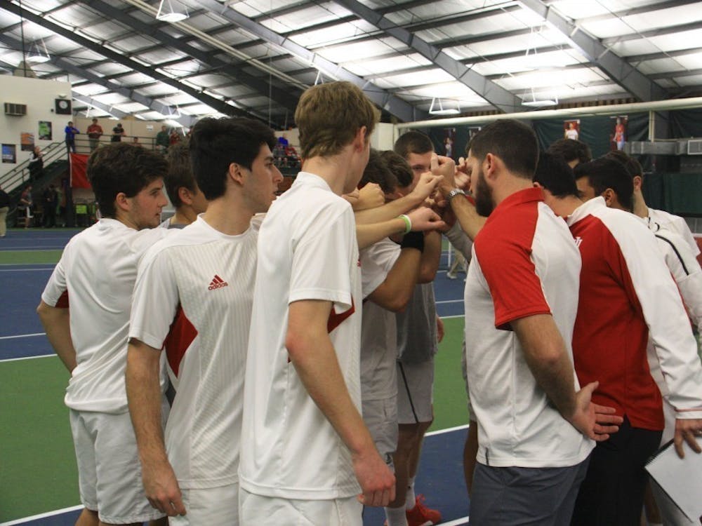 The IU men's tennis team gathers with coaches before a singles match against Purdue in April of 2017 at the IU Tennis Center. IU will face Texas Tech on Feb. 17 in Lubbock, Texas.