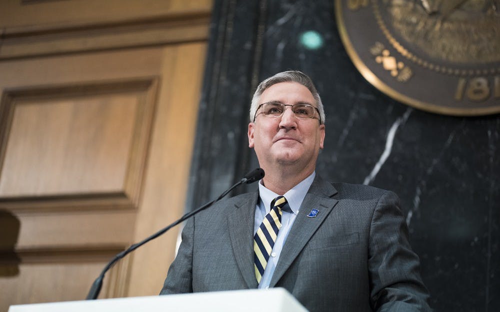 Governer Holcomb stands before the state legislators and other invited guests at his first State of the State address Tuesday night at the Indiana Statehouse. He speaks about his five pillars of improvement for Indiana, which includes making new roads and raising the budget for Pre-K schooling. 