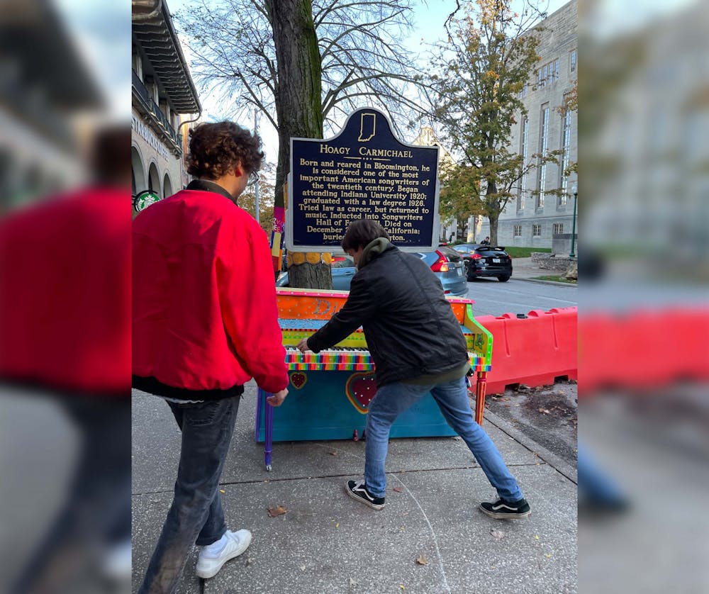 <p>Volunteers of the B-Town Piano Project install a piano on Indiana Avenue. Started by B-Town Piano Project founder Chandler Bridges, the project is meant to make musical instruments more accessible.</p>