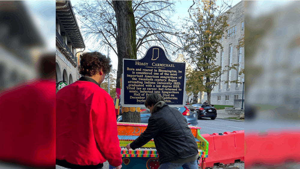 Volunteers of the B-Town Piano Project install a piano on Indiana Avenue. Started by B-Town Piano Project founder Chandler Bridges, the project is meant to make musical instruments more accessible.