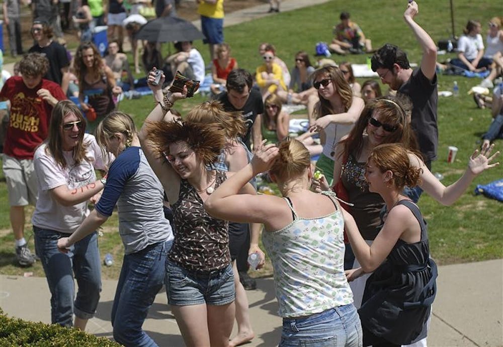 Residents of Collins LLC dance to the music of local band Go, Go Gadget! Saturday afternoon in the Collins Courtyard during CollinsFest. The annual event included several other bands, free food, tie-dying t-shirts and other activities.