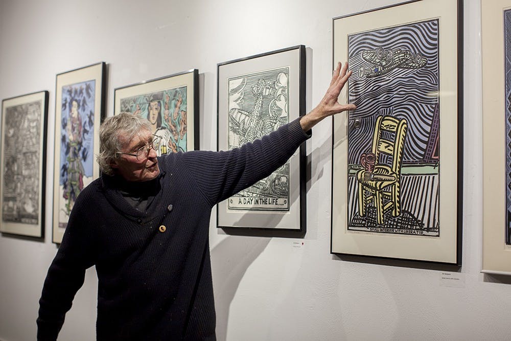 Printmaker Jim Simpson talks about his linocut prints at Blueline Media Productions on Thursday.  His work will be on display until Jan. 30th.