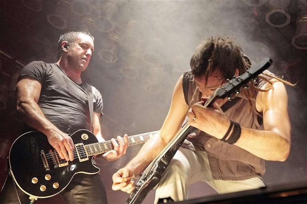 Nine Inch Nails Trent Reznor, left, and Robin Finck perform during the Bonnaroo Arts and Music Festival in Manchester, Tenn., Sunday, June 14, 2009. 