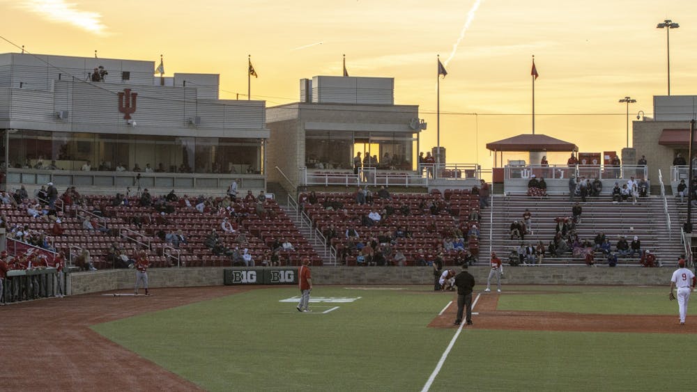 The sun sets behind the stands of Bart Kaufman Field on March 1, 2022. Indiana’s game against Indiana State University, originally scheduled for Tuesday, was postponed due to weather.