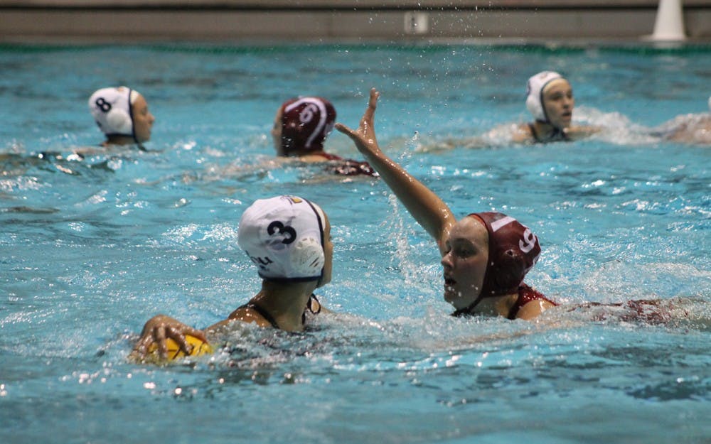 California Baptist University sophomore, Lizette Perez, holds the ball away from IU junior Sarah Myers during the match-up Saturday. Myers finished the game with one goal and one assist helping the Hoosiers defeat the Lancer 13-6.