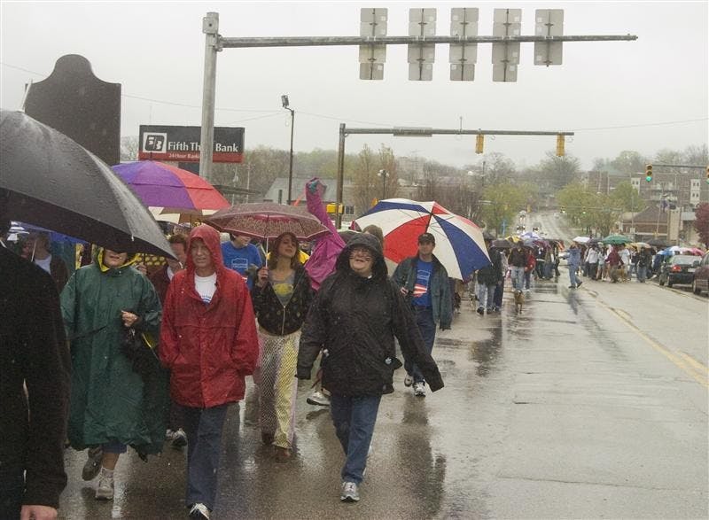 Participants of the Homward Bound 5K Walk march Sunday afternoon down Third Street. The Walk benefits the homeless and poor in Bloomington.