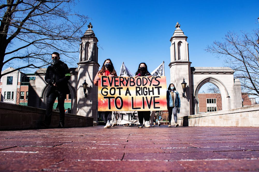 <p>Dozens of protesters march into campus Saturday afternoon for the “March to End the Madness.&#x27;&#x27; The group walked to IU&#x27;s tailgate fields where they hoped to gather attention from the ongoing NCAA men’s basketball tournament games. </p>