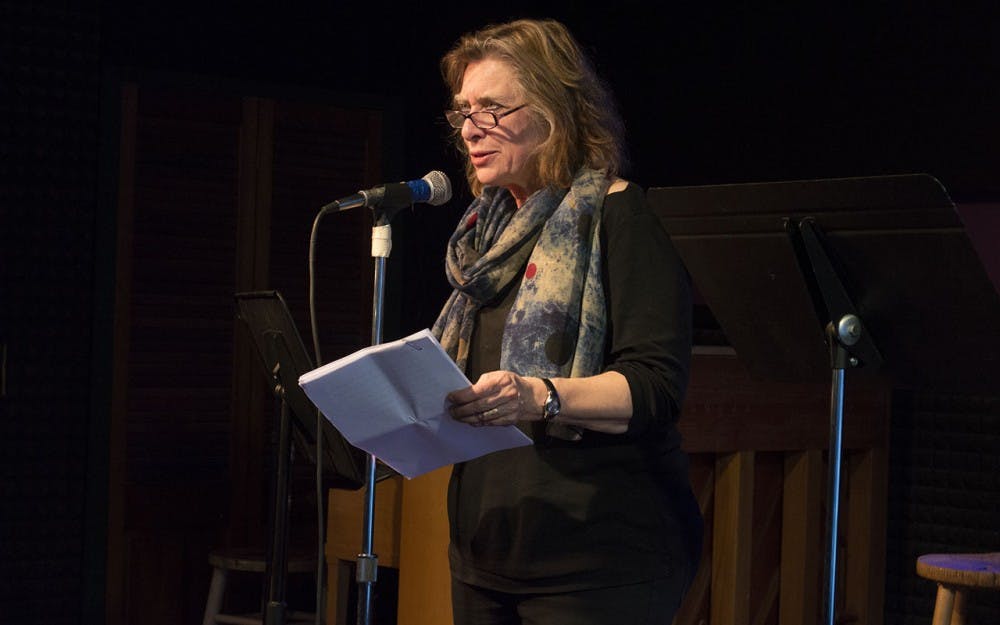 IU Media School professor Joan Hawkins introduces the next act in Player's Pub "Spoken Word," &nbsp;event Thursday evening. Hawkins also preformed two pieces, "The Ballad of Renee and Buzz" and "Leonard Cohen and Edie Sedgwick at the Chelsea Hotel."&nbsp;&nbsp;