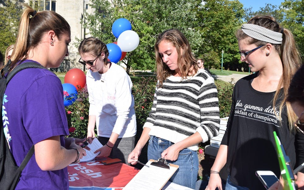 Memebers of the greek community help students get registered to vote in the upcoming election.
