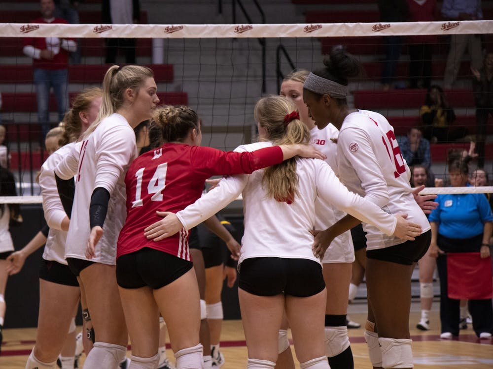 IU volleyball players confer between points during the fifth set against Iowa Oct. 26, 2019, at Wilkinson Hall. The team will move on to face Purdue at 7 p.m. Oct. 14, 2022, at Wilkinson Hall.