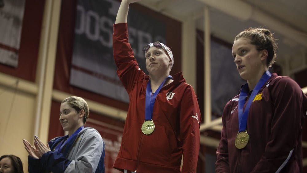 Senior Lilly King waves to the crowd during the award ceremony Feb. 22 in the Counsilman Billingsley Aquatic Center. King is part of a group of 17 IU athletes who qualified for the NCAA Women’s Swimming and Diving Championships.﻿
