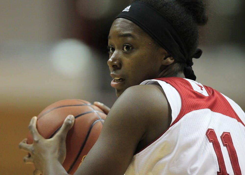 Junior forward Kym Royster holds the ball, waiting for a teammate to be open during IU's game against North Texas Tuesday night at Simon Skjodt Assembly Hall. IU defeated North Texas 68-63.