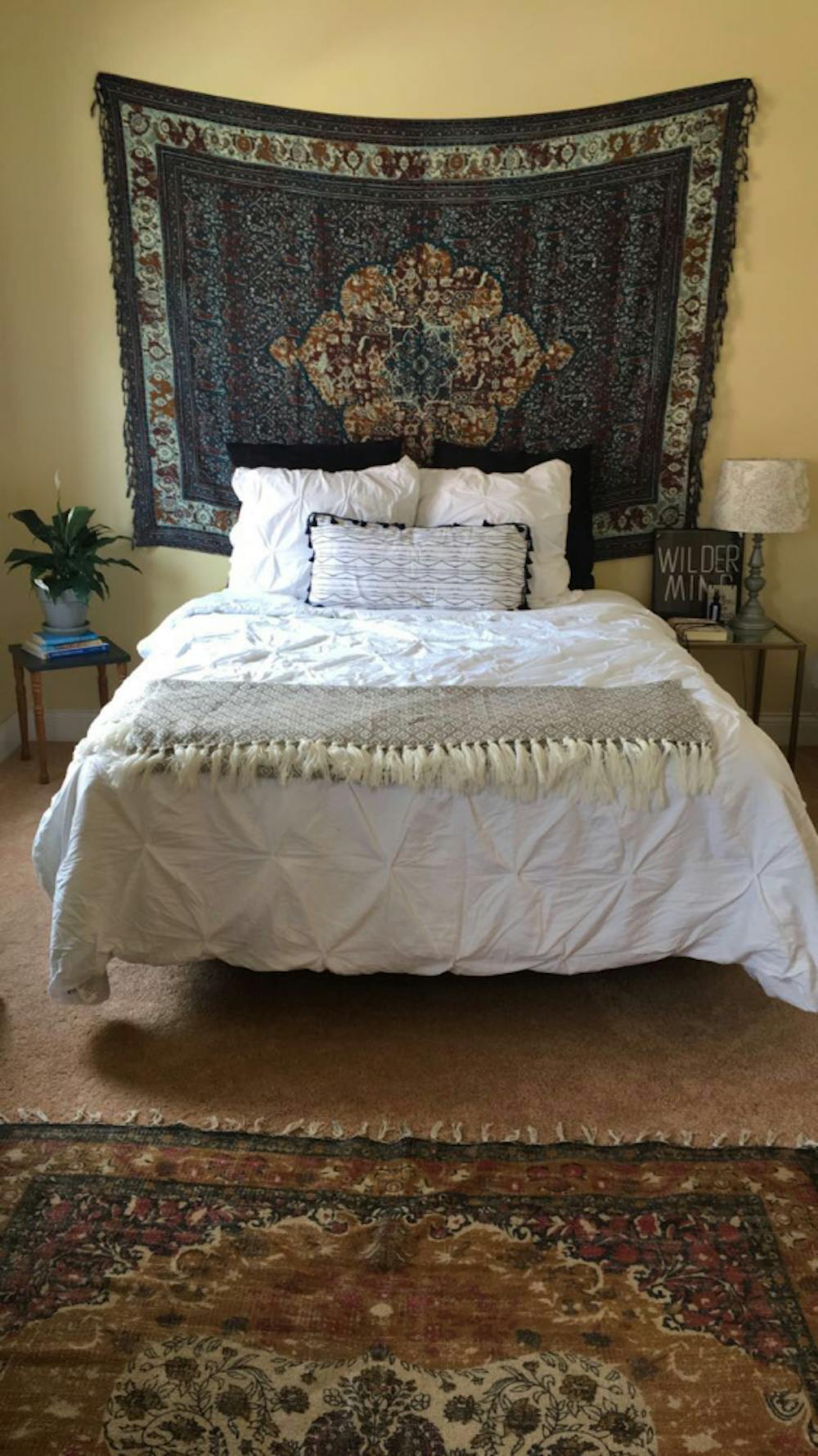 With bedding from Target, a homemade pillow and tapestry from Urban Outfitters, Gardetto gives a cozy feel to where she sleeps. A rug from World Market brings together the entire area.
