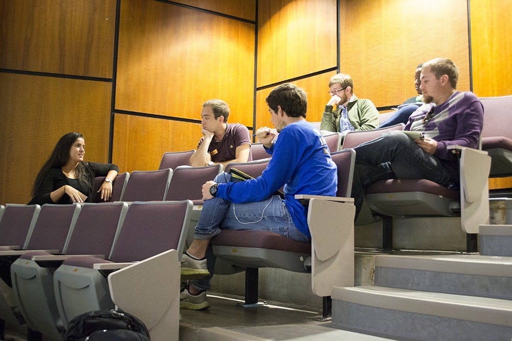 The Graduate and Professional Student Government broke into committees at a fall 2015 assembly meeting. GPSG&nbsp;passed a resolution&nbsp;Friday afternoon&nbsp;in opposition to a tuition policy that charges graduate students up to thousands of dollars more if they take even one credit in a school other than the one in which they take most of their classes.