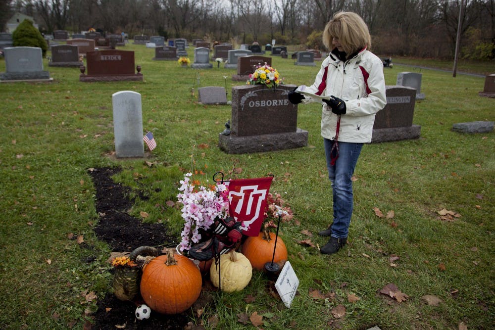 Angi Fiege stands at the grave of her  19 year old daughter Rachael, who died Aug. 23, 2013 after falling down a set of stairs at her first party at IU. In the months after her death, Rachael's family and friends have been burdened by misconceptions of who their daughter was and what really happened to her that night. 