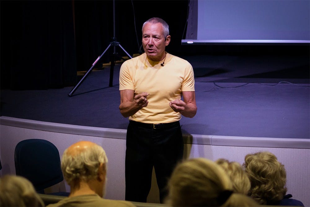 Speaker Michael May discusses the concept of reality at The Ultimate Reality seminar held Wednesday at the Monroe County Public Library. The program explores applied contemporary reality through a series of short films.