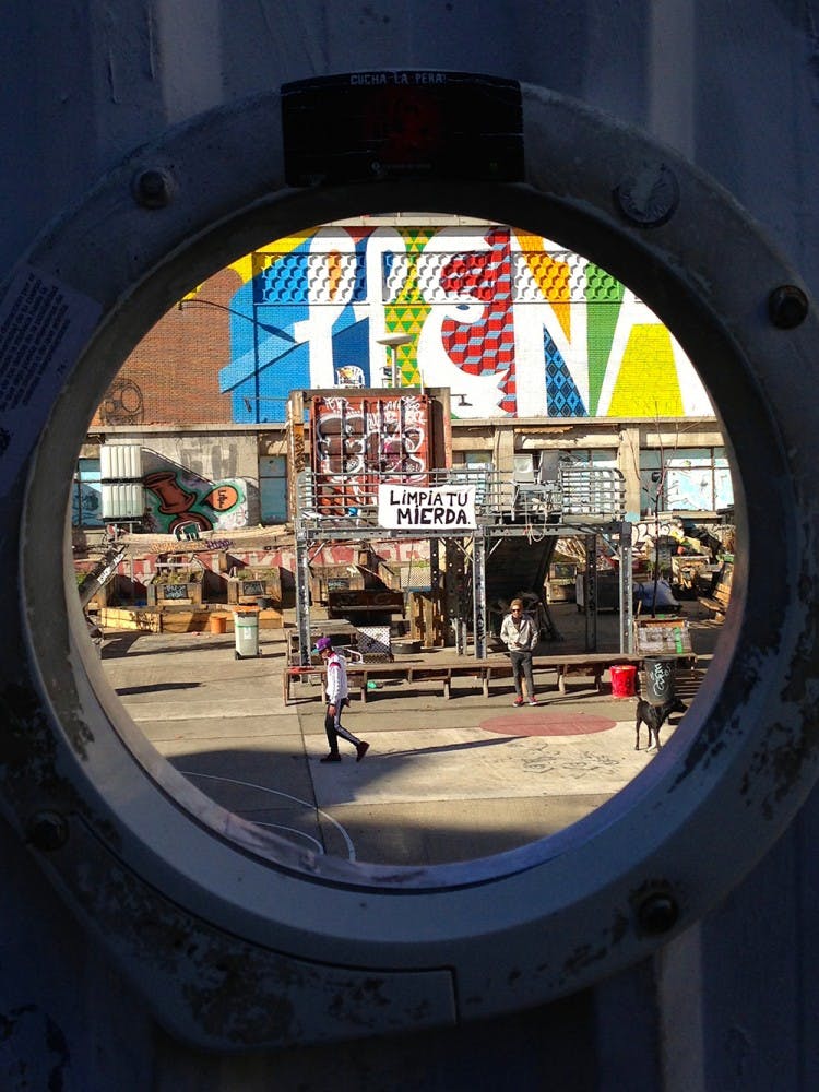 Seen through a hole in the wall, young Madrileños hang out in a skatepark they created in an abandoned construction sight. Madrid has been the sight of decades of counter-culture in Spain and younger generations have always been extremely politically active. This skatepark is not just a place to hang out, but a political statement.