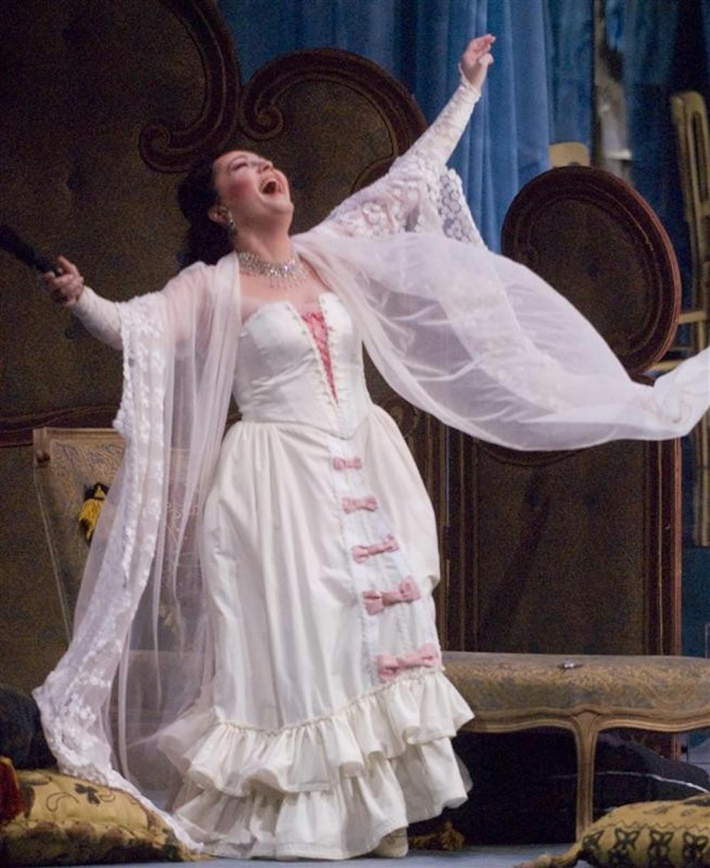 Actress Johanna Ruszala, playing the the part of Violetta Valery for the Giuseppe Verdi opera La Traviata, performs during the production's dress rehearsal on Thursday evening at the MAC.