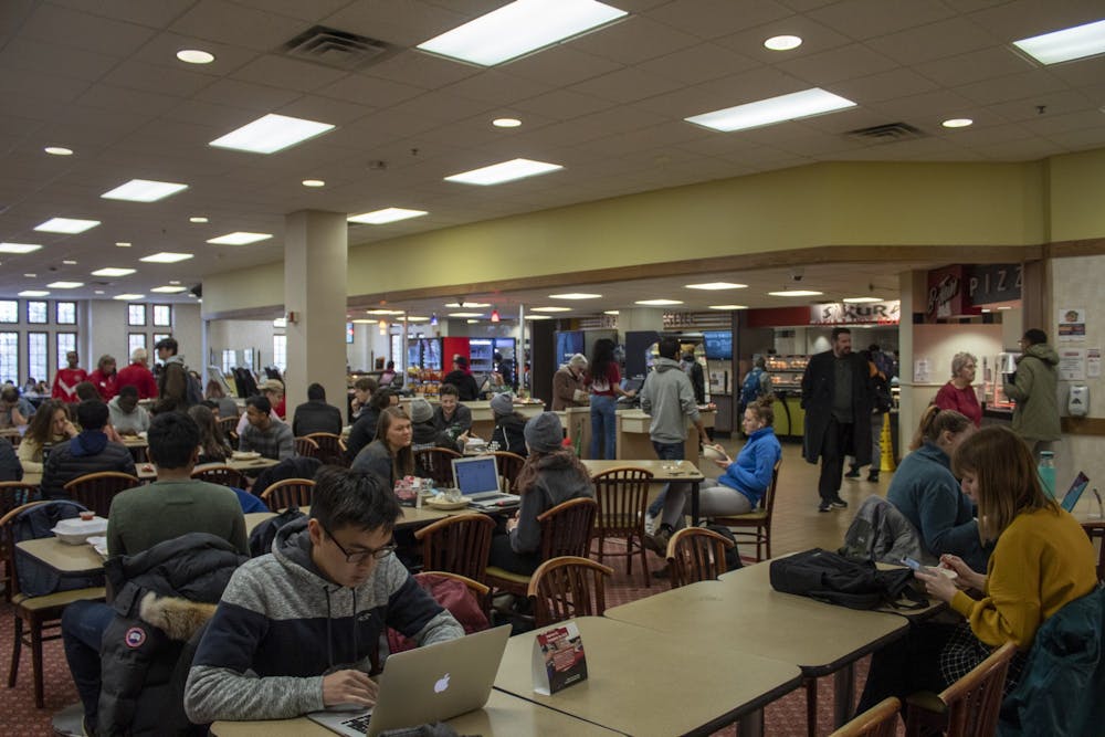 <p>Students sit in the lobby of a dining area Dec. 10 in the Indiana Memorial Union.  The IMU will periodically close eating establishments Dec. 7-23 to prepare for renovations beginning next month.</p>