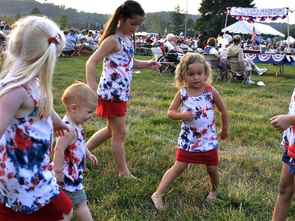 Janel Solie, 4, Abbie Carmichael, 1, Olivia Solie, 7, Avery Freeman, 3, and Emmie Freeman, 4, dance to the sound of The Singing Hoosiers. The family-oriented event included a children’s fun-zone and a performance by Magician Travis Sims. 