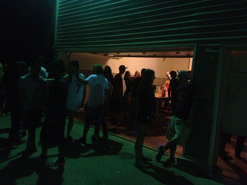 Students drink and socialize at a house party near the Indiana University Bloomington campus. Indiana law dictates that consent for sex cannot be given if one or more of the individuals is under the influence of alcohol or drugs.