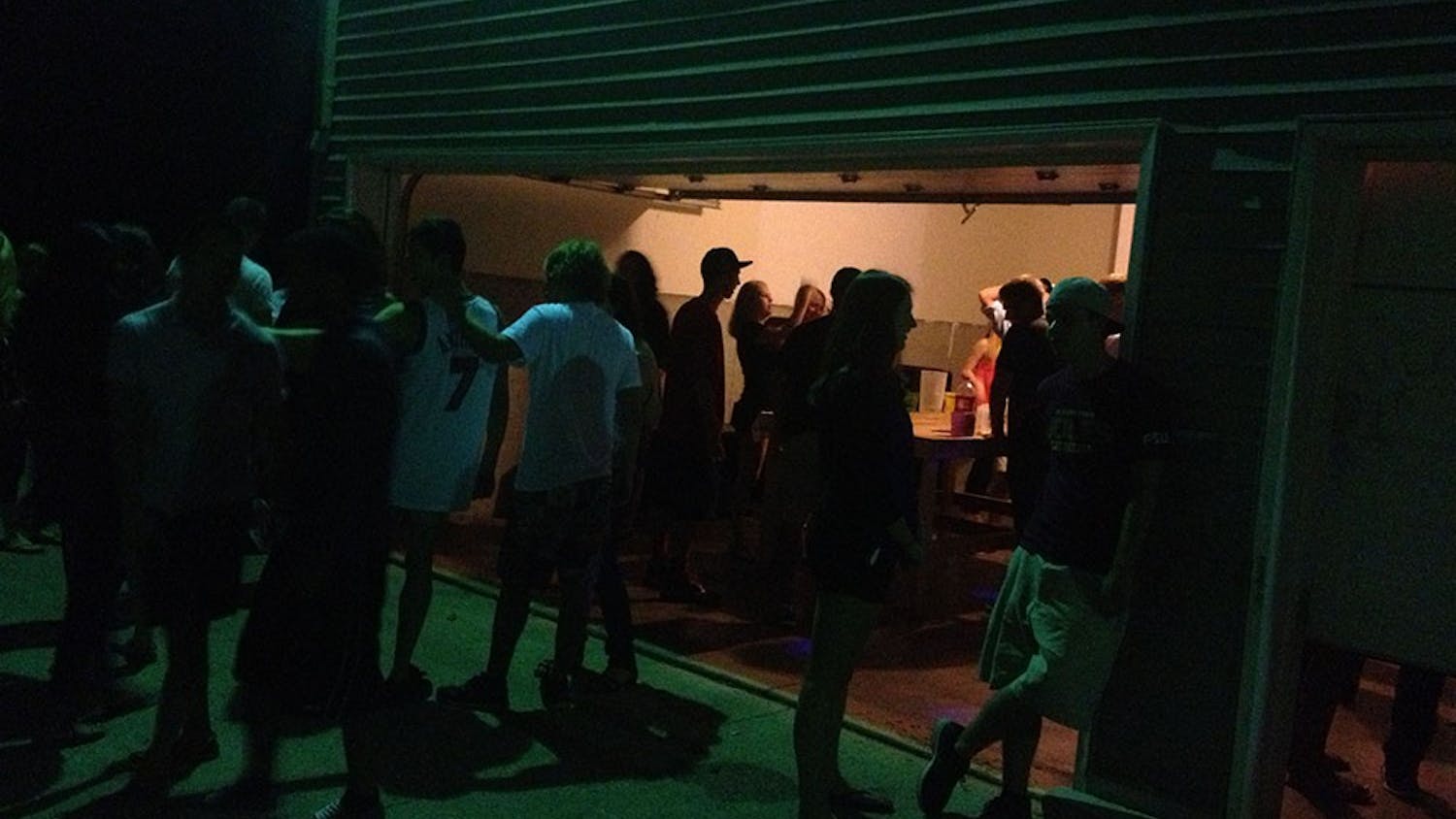Students drink and socialize at a house party near the Indiana University Bloomington campus. Indiana law dictates that consent for sex cannot be given if one or more of the individuals is under the influence of alcohol or drugs.
