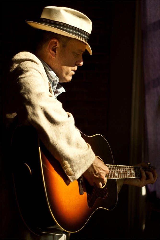 Tom Roznowsk, 63, is a local singersong writer known for his album “A Well Traveled Porch,” ranked 24 on the Gavin Americana chart. He often sings about his work on the public television special Hometown: A Journey Through Terre Haute; and his book An American Hometown, published by Indiana University Press. 