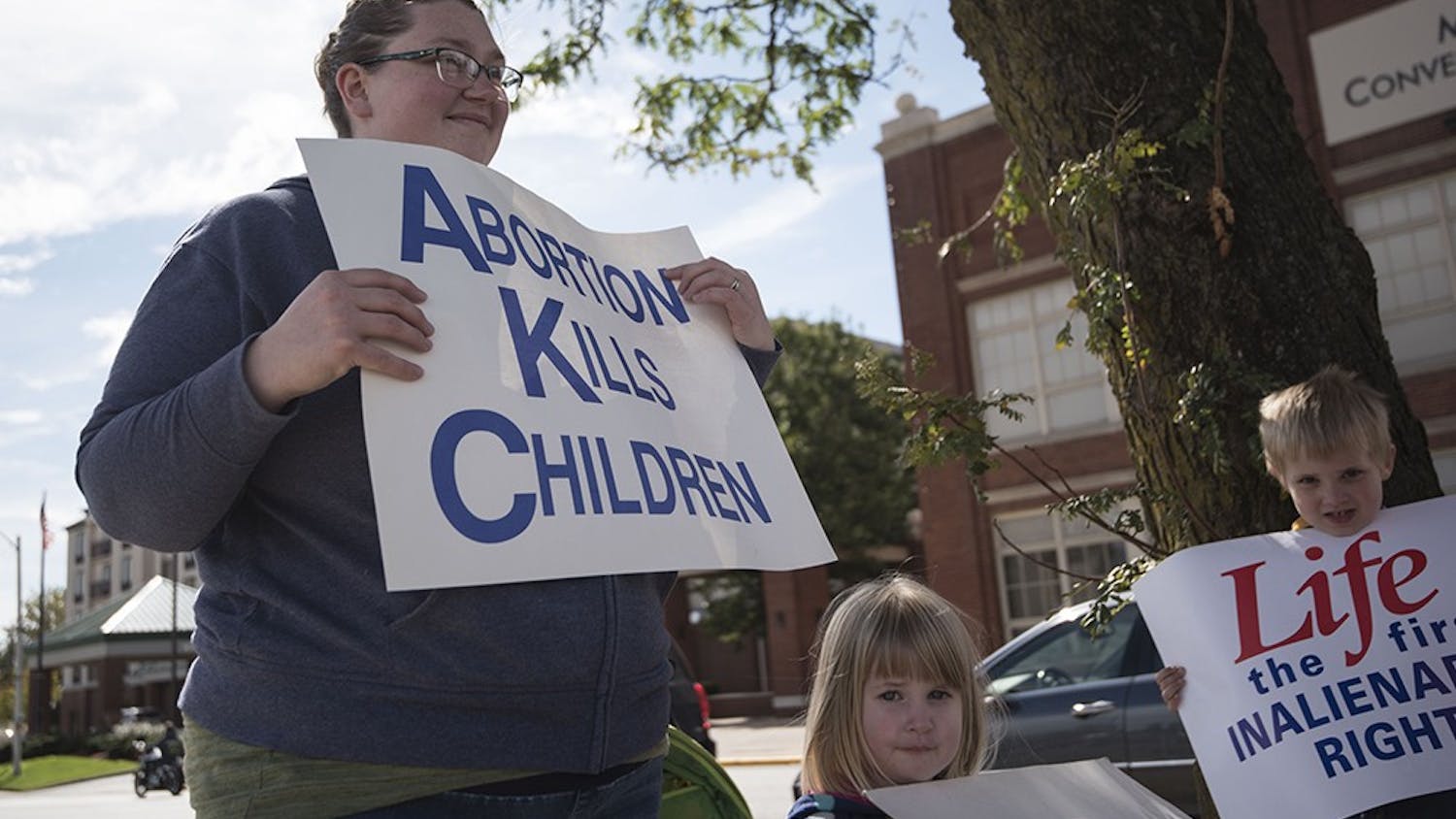 Amber Nikirk and her children Lily and Jeremiah hold pro-life signs on Oct. 1. Pro-life advocates like Nikirk won a major victory in June 2018 when the Supreme Court ruled in their favor in NIFLA v. Becerra&nbsp;