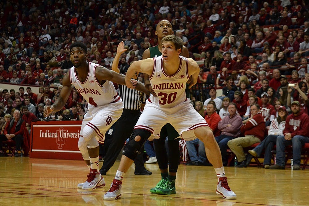 Sophomore forward Collin Hartman and Freshman guard Robert Johnson box out an offensive player during the game against Mississippi Valley State Friday at Assembly Hall.