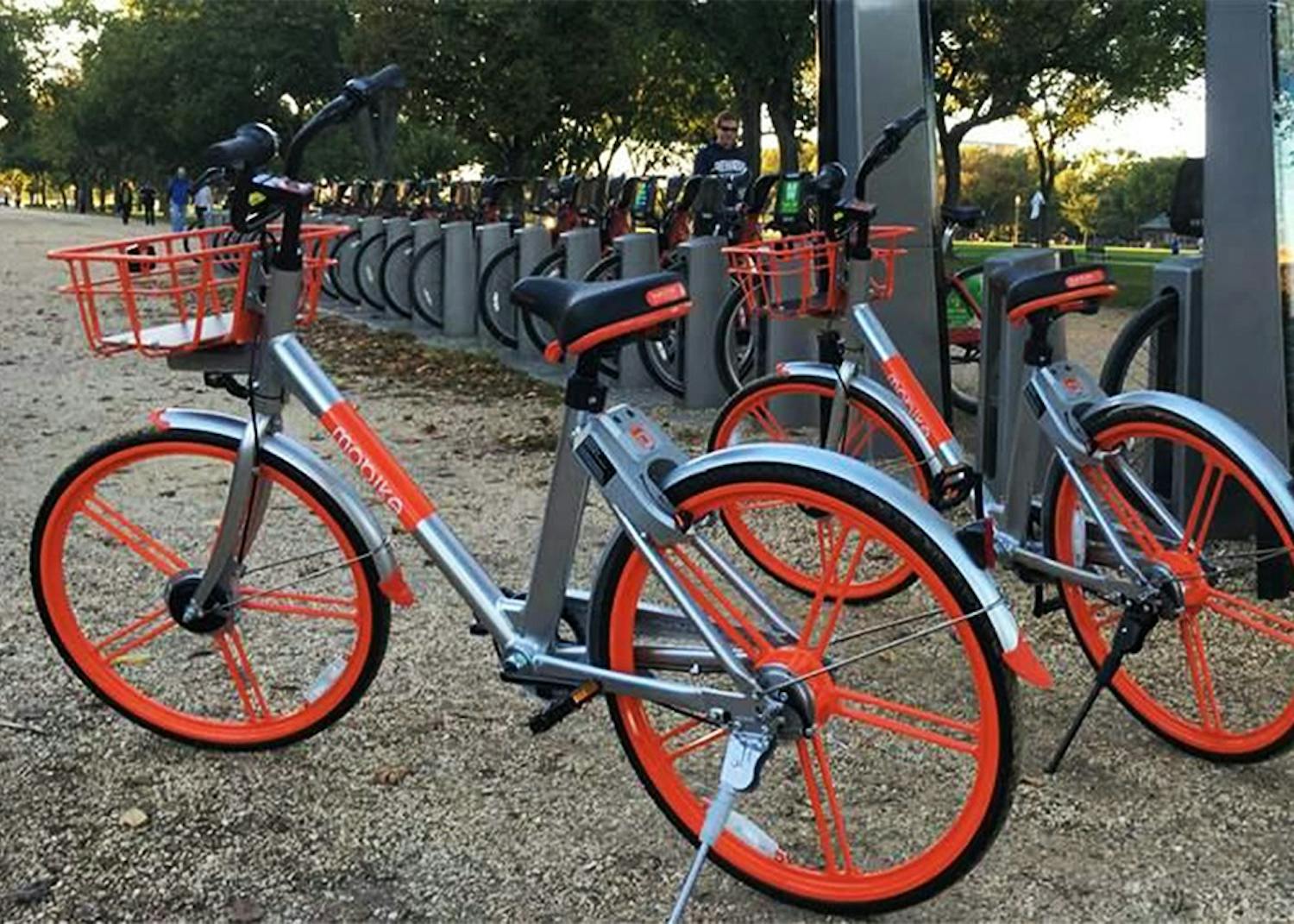 Dock-less bikes park next to a docking station for Capital Bikeshare, in Washington, D.C. Bloomington city officials will work with South Bend, the first city to implement a dock-less bikeshare program in Indiana, as it works to create a bikeshare program in Bloomington.