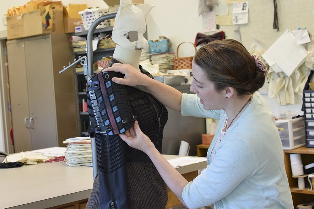 Kelsey Nichols works on some of the details of the costume for Scratchy in the production of "Mr. Burns, a post-electric play". Nichols made the costumes out of materials not typically used in clothing to reflect what the characters may have done.