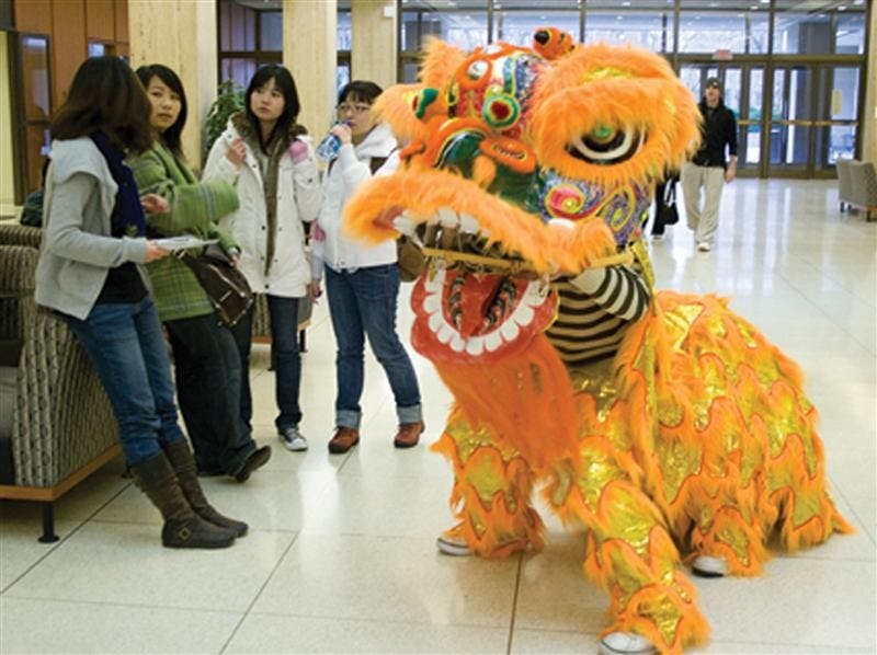 A human-operated Chinese lion greets students in the Herman B. Wells Library lobby Feb. 7, 2008. Sophomores Li Yong and Luo Xiaoyn operated the lion and paraded around campus along with other members of the IU Chinese Student and Scholar Association in order to promote the club’s Chinese New Year celebration.