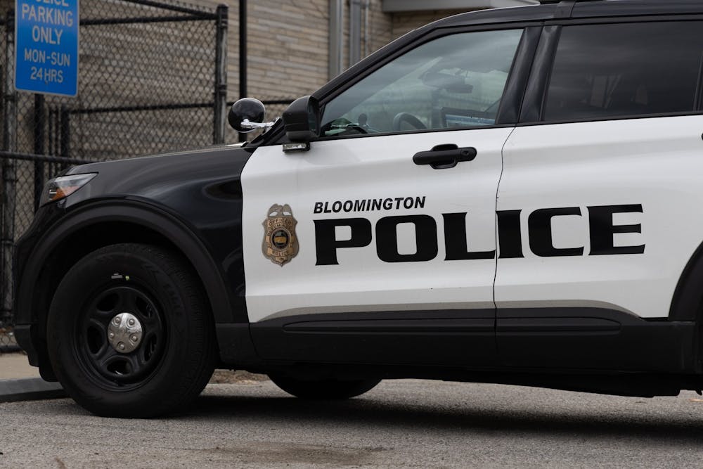 <p>A police car is parked outside the Bloomington Police Department on Feb 22, 2023. House Bill 1186, authored by Rep. Wendy McNamara, R-District 76, would make it a crime for a person to approach a law enforcement officer within 25 feet after being told to keep away.</p>