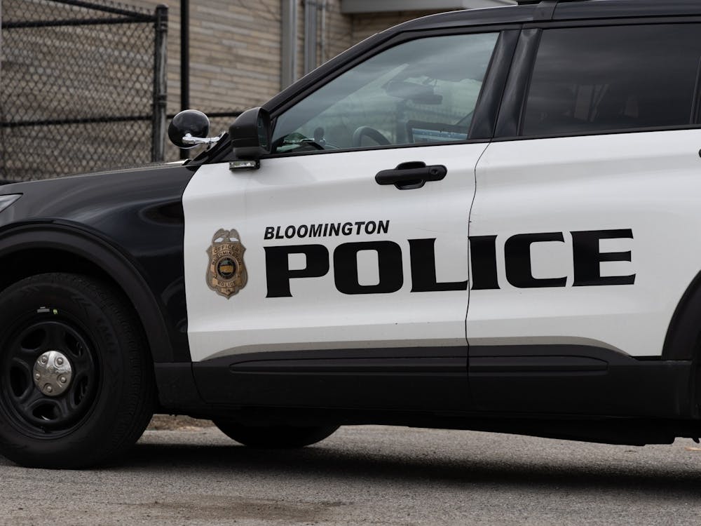 A police car is parked outside the Bloomington Police Department on Feb 22, 2023. House Bill 1186, authored by Rep. Wendy McNamara, R-District 76, would make it a crime for a person to approach a law enforcement officer within 25 feet after being told to keep away.