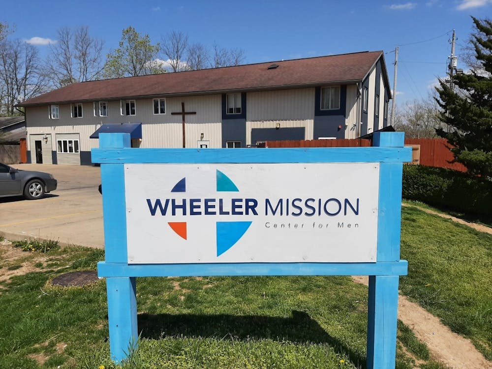 <p>The sign of the Wheeler Mission Center for men is pictured at 215 S Westplex Ave in Bloomington. The Wheeler Mission provides housing to men experiencing homelessness. </p>