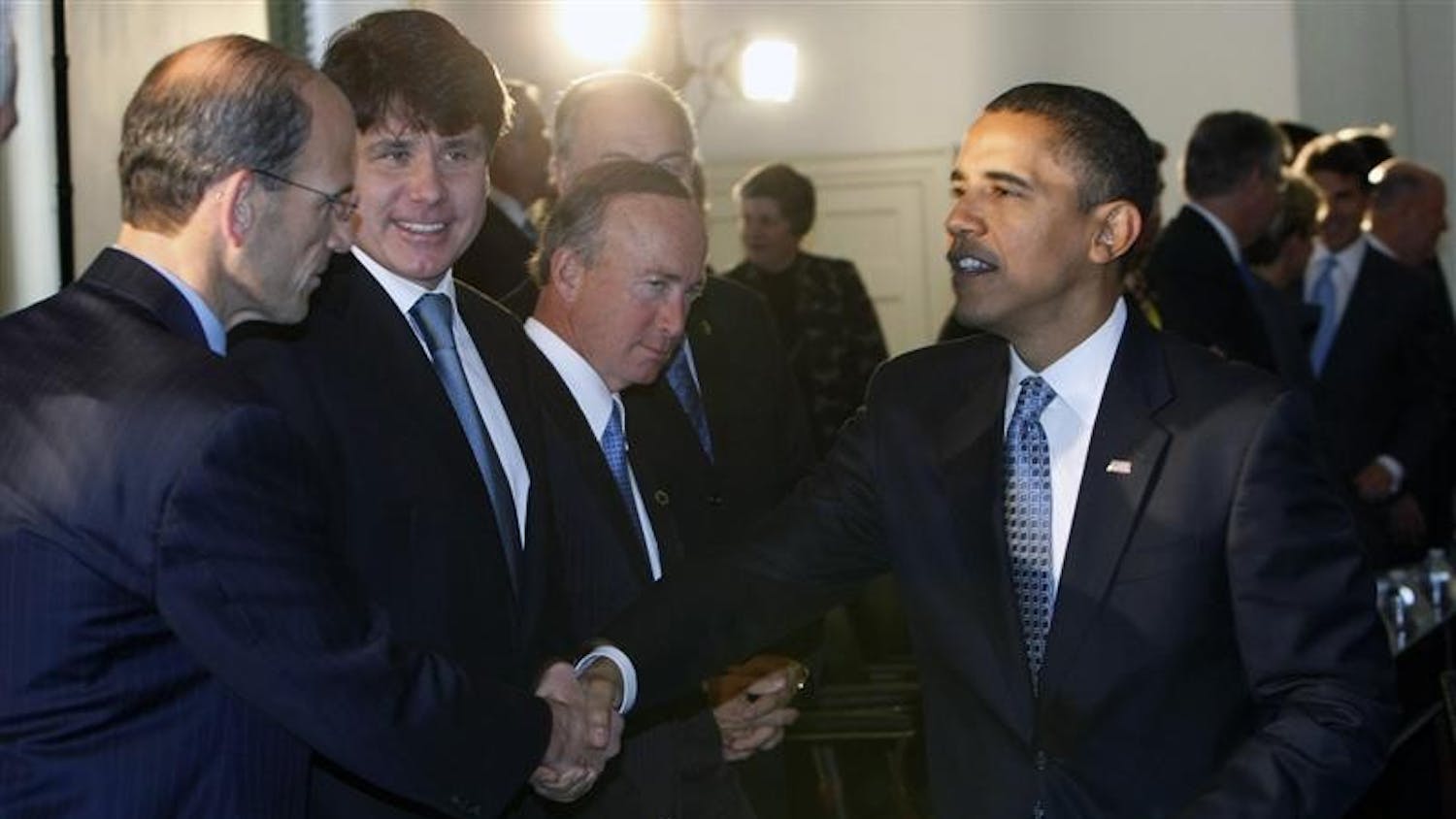 President-elect Barack Obama, right, greets Maine Gov. John Baldacci, left, at the Bipartisan meeting of the National Governor's Association on Tuesday at Congress Hall in Philadelphia, Pa. Looking on are,  Illinois Gov. Rob Blagojevich, left cente, and Gov. of Indiana, Mitch Daniels, center.