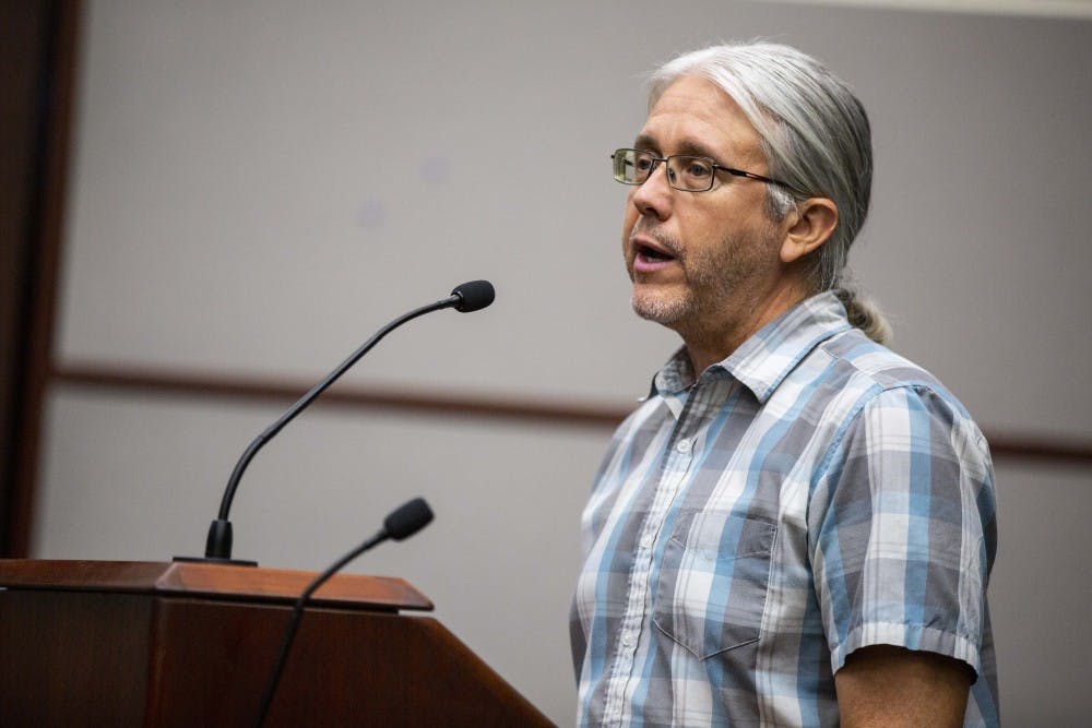 <p>Steve Cotter, natural resources manager for the Bloomington Parks and Recreation Department, talks about the deer population during a hearing over a proposed deer hunting amendment Sept. 19 in City Hall.&nbsp;</p>