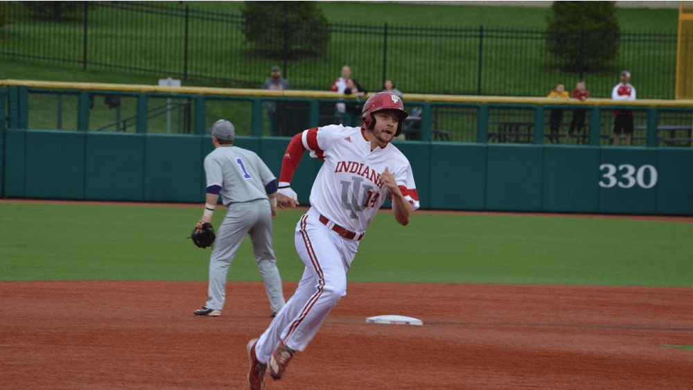 Then-sophomore infielder Matt Lloyd, now-junior, runs to third base after his teammate, Tony Butler, hit a grounder to left field during the 2017 season. Lloyd was named a second team All-American on Thursday.