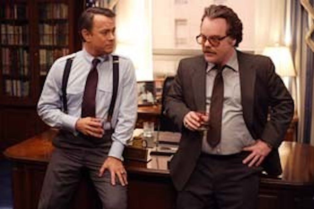 Congressman Charlie Wilson (TOM HANKS) receives a briefing from CIA agent Gust Avrakotos (PHILIP SEYMOUR HOFFMAN) in the film that tells the raucous true story of the largest covert operation in history: ?Charlie Wilson?s War?.