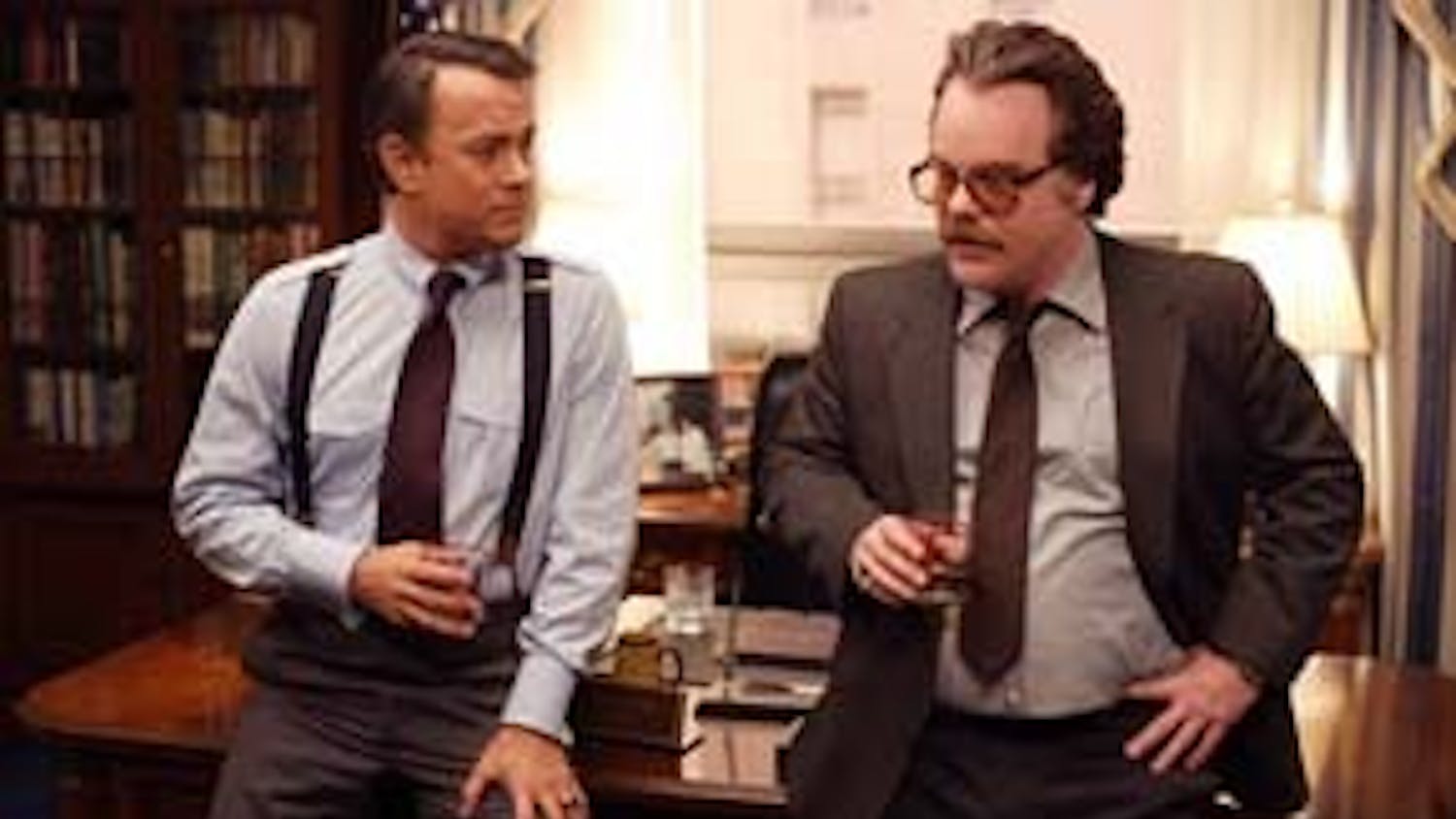 Congressman Charlie Wilson (TOM HANKS) receives a briefing from CIA agent Gust Avrakotos (PHILIP SEYMOUR HOFFMAN) in the film that tells the raucous true story of the largest covert operation in history: ?Charlie Wilson?s War?.