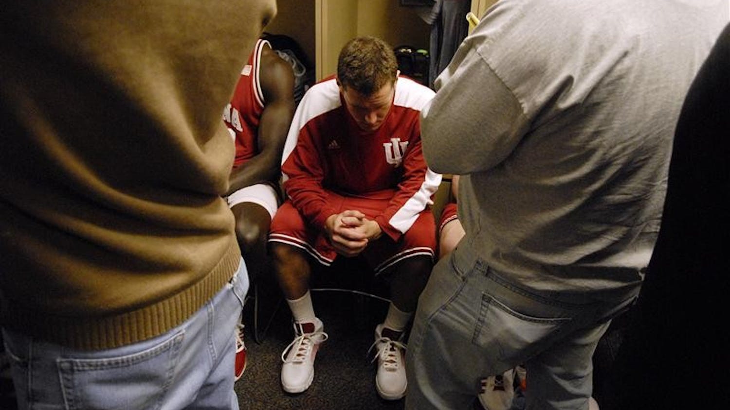 IU freshman foward Kory Barnett sits quietly in the locker room as members of the media conduct interviews following IU's 66-51 loss to Penn State on Thursday at Conseco Fieldhouse in Indianapolis.