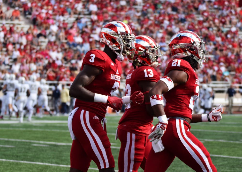 <p>Junior Tyler Green jogs with teammates back to the rest of the team during a timeout in the first quarter of the Oct. 7 game against Charleston Southern at Memorial Stadium. IU's defense shut out Charleston Southern, but failed to record any takeaways in the win.</p>