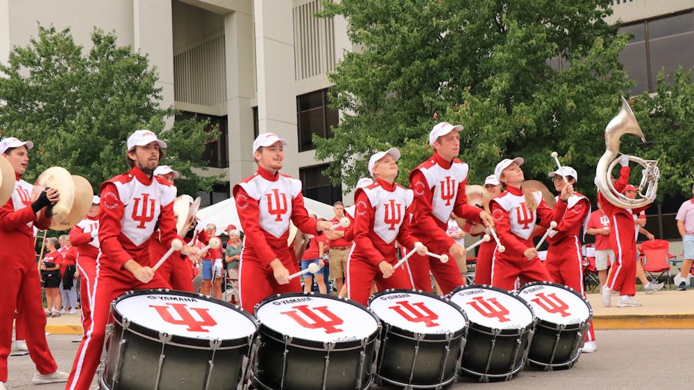 IU Marching Hundred bass drummers play music before a football game against University of Connecticut Sept. 21, 2019 near Assembly Hall. Newlyappointed director of athletic bands Eric Smedley is an alumnus of the Marching Hundred.