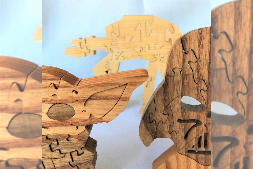 <p>Wooden jigsaw puzzles, made by Marc Tschida who owns the business Press Puzzles, are pictured. Tschida sells puzzles of Bloomington buildings and geometric puzzles at A Fair of the Arts.</p><p><em>CORRECTION: A previous version of this caption misstated the name of A Fair of the Arts. </em></p><p> </p>