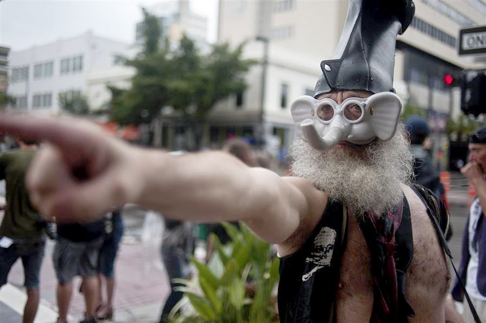 Presidential hopeful Vermin Supreme talks to protesters on Aug. 27, 2012 outside the Republican National Convention in Tampa Bay, Florida.