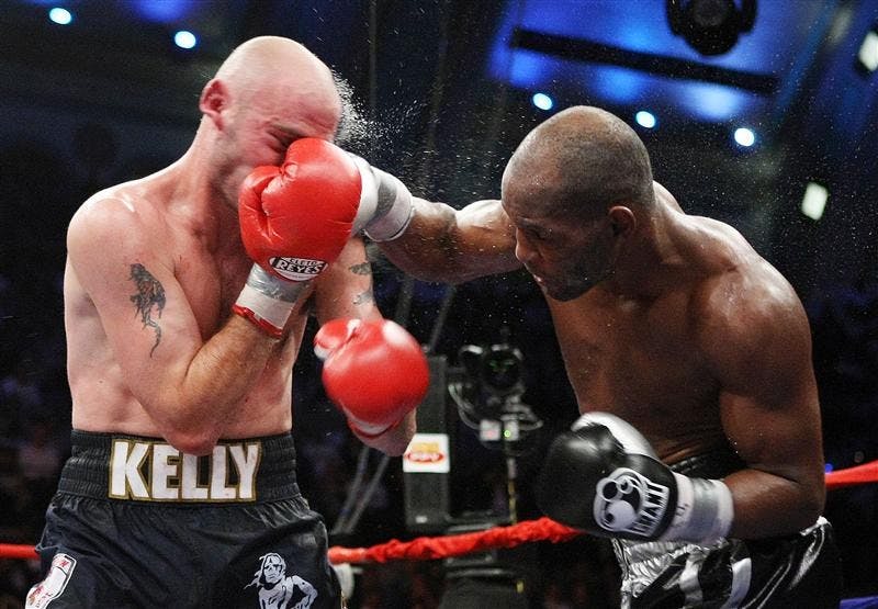 Bernard Hopkins, right, lands a punch on Kelly Pavlik during the 7th round of light heavyweight boxing match on Saturday in Atlantic City, N.J. Hopkins won by unanimous decision in 12 rounds.