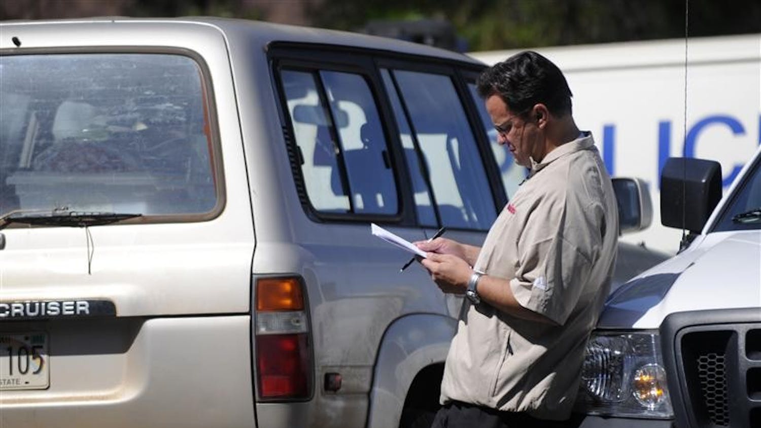 IU coach Tom Crean reads a document Tuesday in the parking lot of the Lahaina (Hawaii) Civic Center, the site of the EA SPORTS Maui Invitational. Earlier in the day, Crean's Hoosiers fell 80-54 to Saint Joseph's in the second round of the tournament.