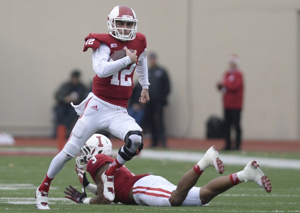 Freshman quarterback Zander Diamont runs the ball during IU's game against Purdue on Saturday at Memorial Stadium.
